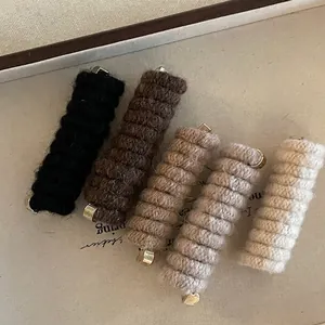 Five knit wrapped telephone wire hair ties in classic earth tones for women's ponytails