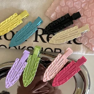 Set of 8 candy-colored metal hair clips with hammered texture and non-slip alligator grip
