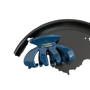 Dark blue minimalist French hair claw clip with golden lettering on glossy resin surface