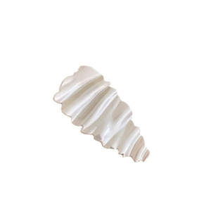 Creamy white duckbill hair clip with textured wavy design and pearlescent finish
