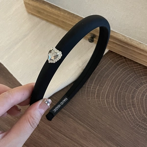 Padded black velvet headband with sparkling heart-shaped rhinestone embellishments