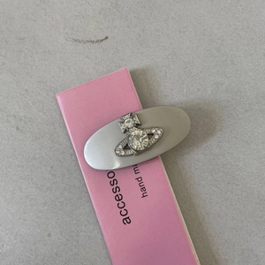 Silver Orb hair clip with crystals on an oval base and pink accessory card