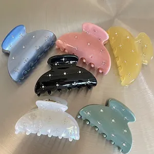 Set of six colorful acrylic hair claws with sparkling rhinestones in assorted Morandi colors