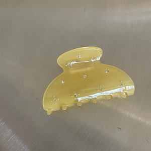 Semi-circular amber resin hair claw clip decorated with sparkling rhinestones for women