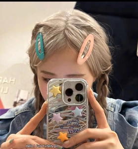 Blue and orange teardrop hair clips with decorative star phone case on model