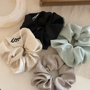 Satin scrunchies set with Love embroidery in black, cream, taupe and green colors