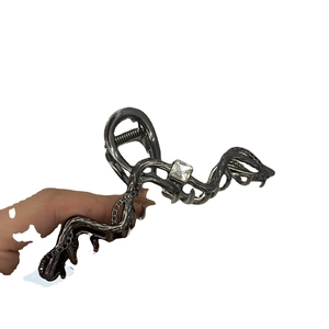 Gothic snake-shaped metal hair claw with square crystal in dark gunmetal finish