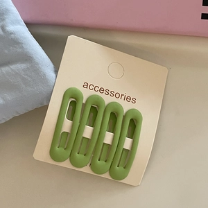 Set of 4 matte grass green oval BB hair clips for girls on beige display card