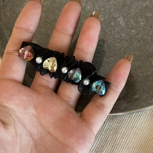 Black satin hair clip featuring colorful heart crystals and white pearls decoration