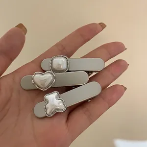 Three-piece minimalist pearl hair clips including heart and bear shapes for women