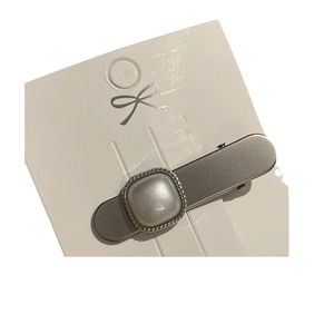 Elegant silver metal duckbill hair clip with square pearl on minimalist display card