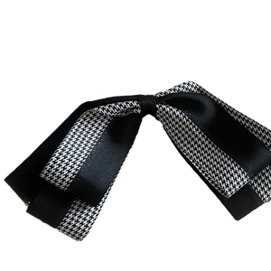 French houndstooth bow hair clip with double-layer ribbons on a clean white background