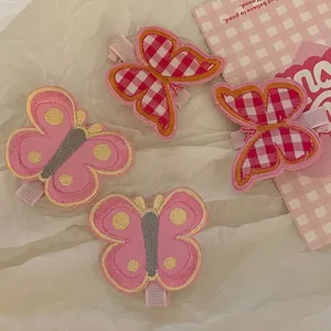 Cute butterfly hair clips set with pink polka dots and checkered embroidery patterns