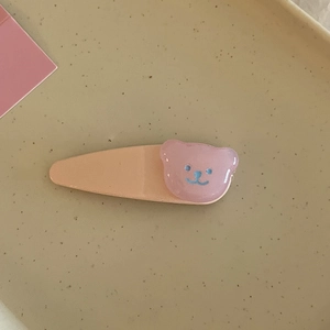 Charmante barrette orange clair avec une tête d'ours rose translucide pour les filles