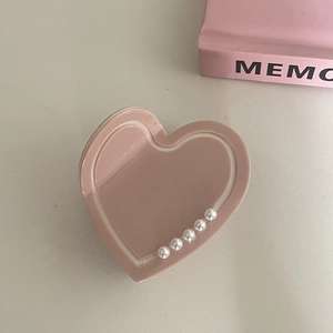 Pink heart-shaped hair claw clip with pearl accents for elegant updos styling