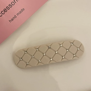 Quilted beige matte hair clip featuring sparkling rhinestones and elegant rectangular design