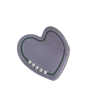 Purple heart-shaped hair claw clip with faux pearl accents and elegant glossy finish
