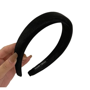 Classic black padded satin headband featuring a handcrafted design and soft velvet texture