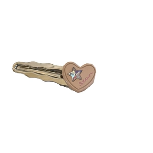 Pince à cheveux avec cœur rose, bord ondulé argenté et strass en forme d'étoile