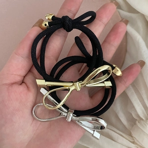 Modern metallic bow hair ties in gold and silver finish with high elasticity black bands