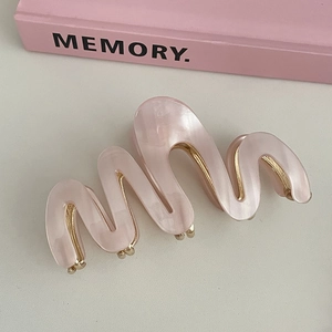 Elegant wavy acetic acid hair claw clip in soft pink marble texture for women