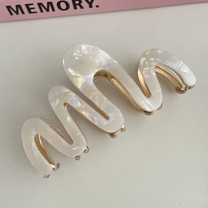 Elegant wavy acetate hair claw clip in creamy white pearl texture for women hair styling