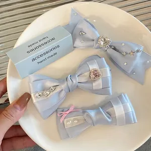 Handmade light blue satin ribbon bow hair clips with heart rhinestones and pearls