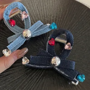 Denim bow hair claw clip with colorful heart crystals and silver metal accent