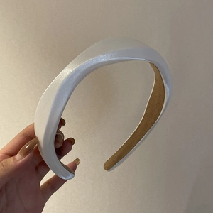 Chic white padded satin headband with glossy wave texture and thick sponge design