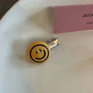 Graziosa clip per capelli gialla con faccina sorridente e fermaglio in metallo a becco d'anatra