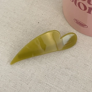 Elegant olive green marble cloud hair clip in handcrafted acetate with heart-shaped detail