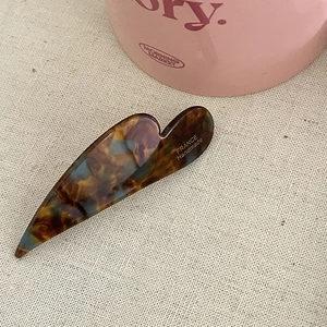 Handmade cloud shaped acetate hair clip with amber marble texture and heart design