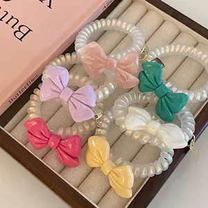 Bowknot Telephone Wire Hair Ring Elegant Artificial Pearl Luster Spiral Hair Ties With Metal Tag Resin Bow Hair Accessories For Women
