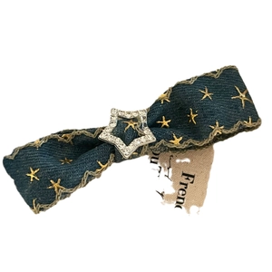 Vintage denim bow hair clip with gold star embroidery and a sparkling rhinestone center