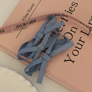 Set of two light blue ribbon bow hair clips for women with elegant woven texture design