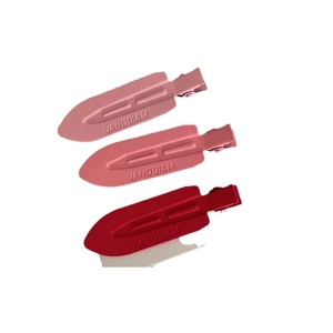 Lot de trois barrettes étoile rose mat avec lettrage UANODIAM embossé pour femmes