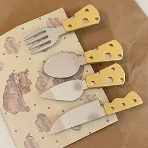 Detail of cheese-themed stainless steel cutlery set with unique yellow textured handles