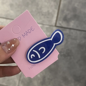 Cute dark blue fish shaped hair clip in glossy acrylic finish for women and girls