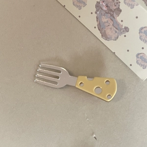 Cute cheese patterned fork hair clip with silver finish and playful yellow resin handle