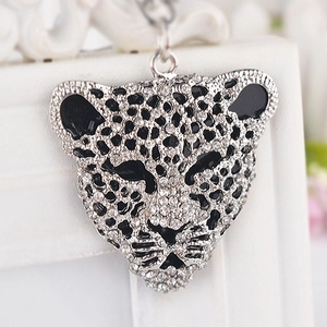 Sparkling leopard head keychain with rhinestones and black enamel spots on silver alloy