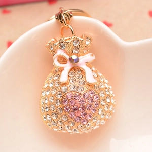Porte-clés sac de fortune chinois avec strass roses et pendentif nœud papillon doré