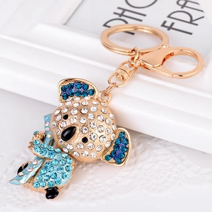 Creative koala keychain with white and blue rhinestones on a gold metal base
