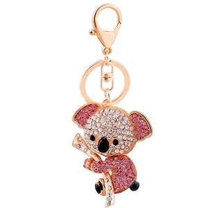 Sparkling koala keychain with pink and white rhinestones on golden metal finish