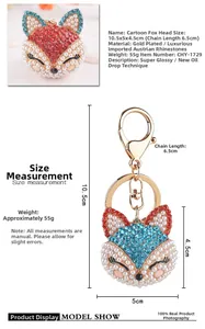 Détail du porte-clés tête de renard avec strass rouges et étiquette de taille 10,5x5cm