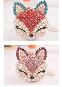 Détails de porte-clés tête de renard avec cristaux incrustés et perles factices