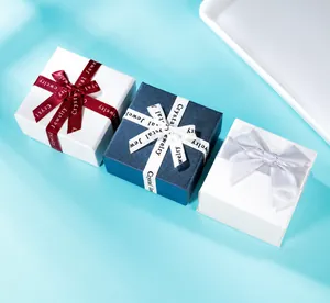 Three elegant square gift boxes with colorful ribbons and Crystal Jewelry branding