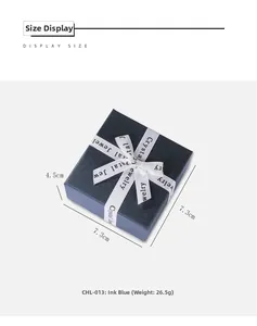Dark blue square jewelry gift box with white ribbon and printed Crystal Jewelry text