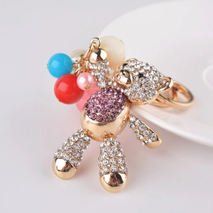 Golden bear keychain with sparkling rhinestones and colorful resin beads decoration