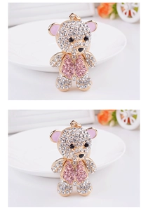Detailed close-up of sparkling crystal bear keychain with pink and clear rhinestones