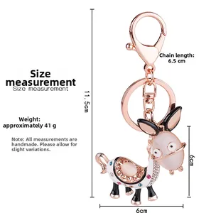 Detailed size view of a cartoon donkey keychain with opal and rose gold plating